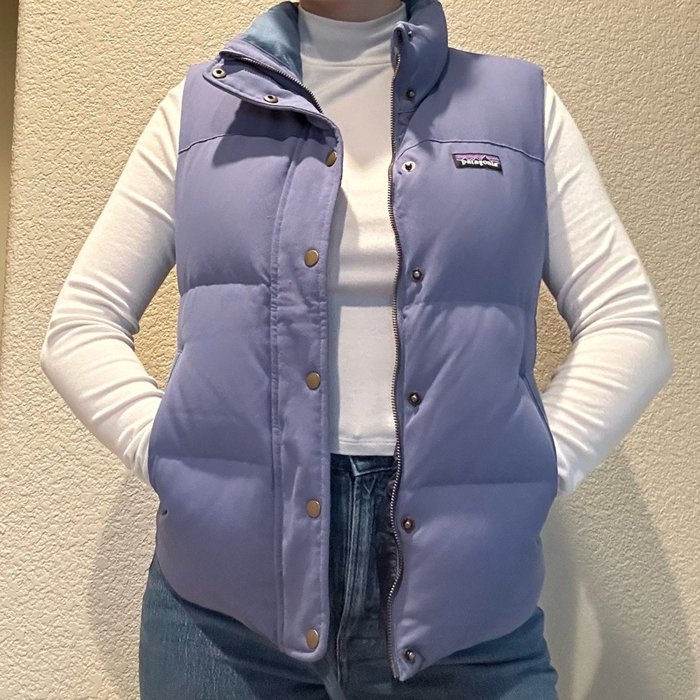 Patagonia women’s puffer vest in size small, in a blue-periwinkle color.